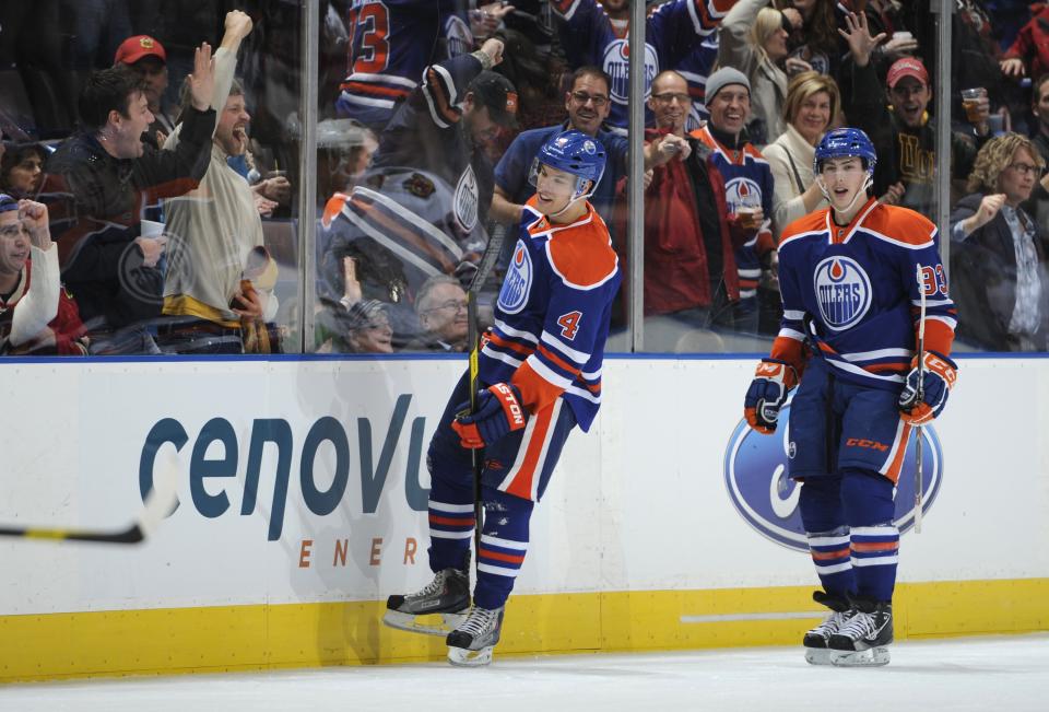 EDMONTON, CANADA - NOVEMBER 19: Taylor Hall #4 and Ryan Nugent-Hopkins #93 of the Edmonton Oilers celebrate Taylor's hat trick goal against the Chicago Blackhawks on November 19, 2011 at Rexall Place in Edmonton, Alberta, Canada. (Photo by Dale MacMillan/Getty Images)