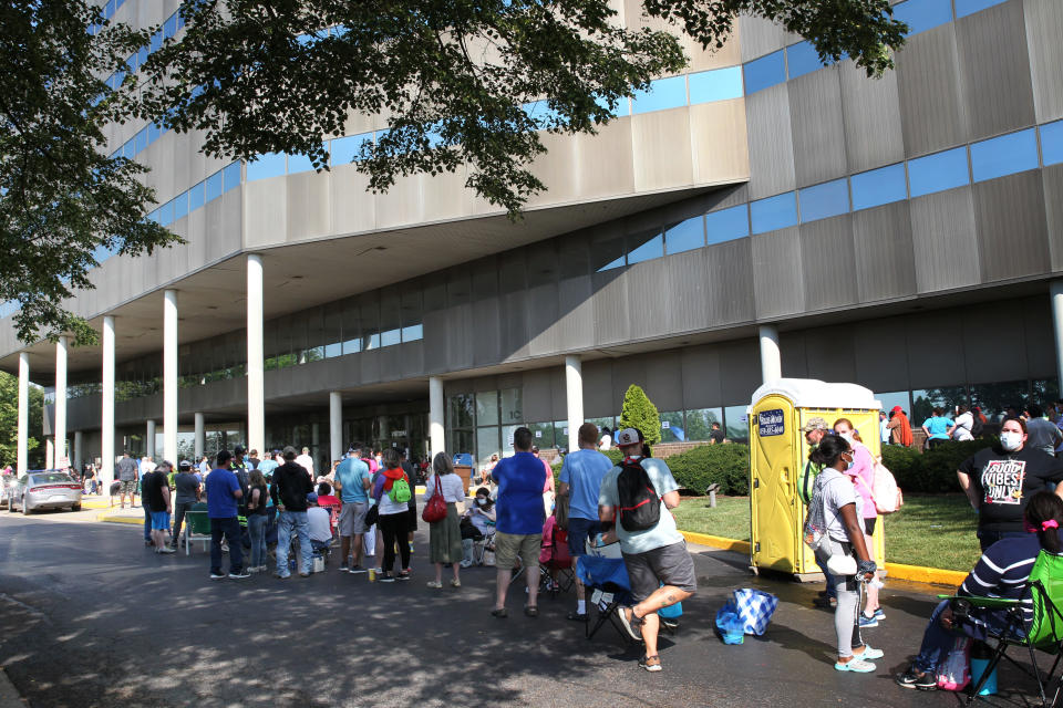 FRANKFORT, KY - JUNE 19: Hundreds of unemployed Kentucky residents wait in long lines outside the Kentucky Career Center for help with their unemployment claims on June 19, 2020 in Frankfort, Kentucky. (Photo by John Sommers II/Getty Images)