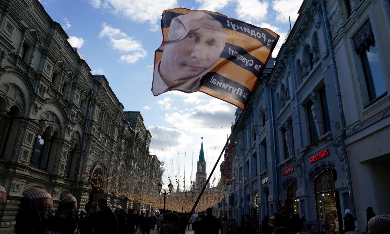 <span>Vladimir Putin’s image is flown on a flag outside the Kremlin in Moscow before this week’s presidential election.</span><span>Photograph: Gripas Yuri/Abaca/PA Images</span>