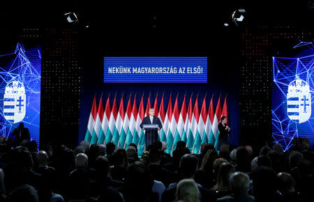 Hungarian Prime Minister Viktor Orban delivers his annual state of the nation speech in Budapest, Hungary, February 10, 2019. Banner reads "Hungary first!". REUTERS/Bernadett Szabo