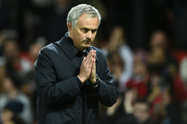 Manchester United's Portuguese manager Jose Mourinho gestures to supporters after their match against Manchester City on October 26, 2016