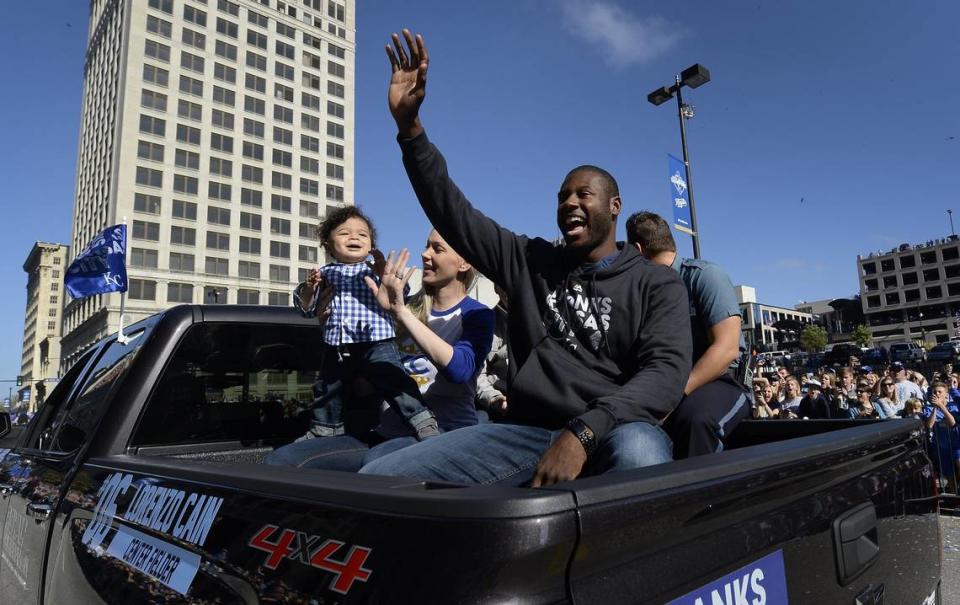 Royals center fielder Lorenzo Cain waved to fans on Tuesday, Nov. 3, 2015, during the team’s World Series victory parade along Grand Boulevard.