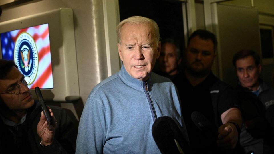 PHOTO: President Joe Biden speaks to members of the media during his flight returning from Israel aboard Air Force One, Oct. 18, 2023. (Brendan Smialowski/AFP via Getty Images)