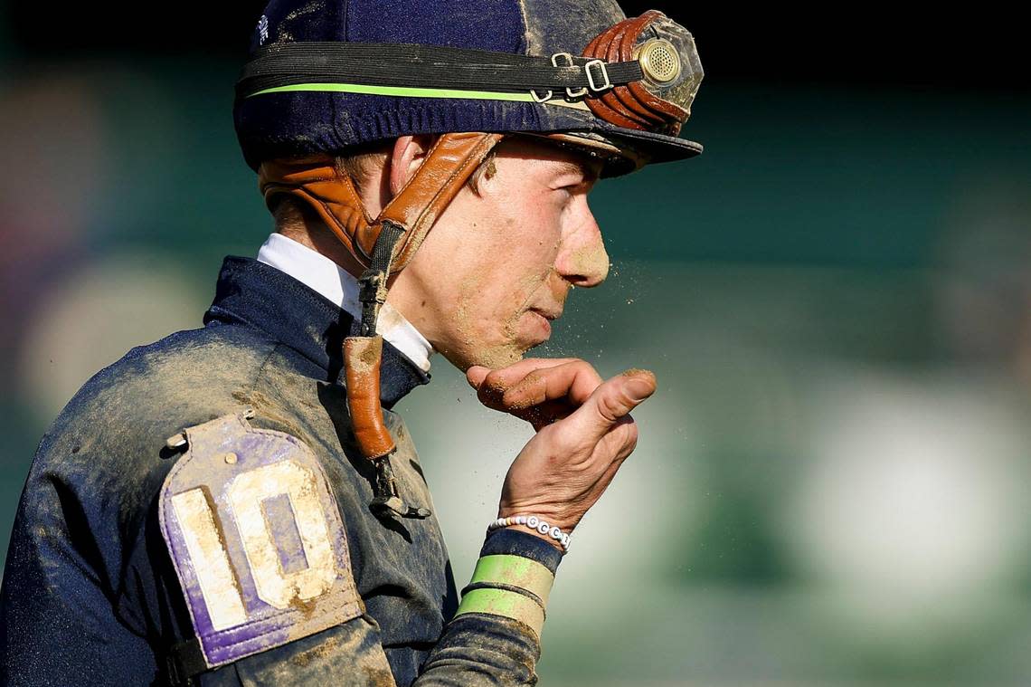 Tyler Gaffalione brushes off dirt from his face after winning the 100th edition of Toyota Blue Grass Stakes, a 200-point Kentucky Derby qualifier with on Sierra Leone during the second day the the Keeneland Spring Meet at Keeneland Race Course in Lexington, Ky, Saturday, April 6, 2024.