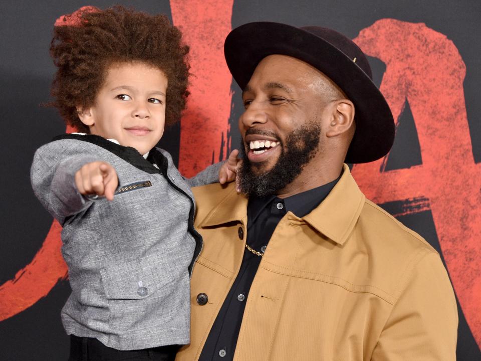 Maddox Boss with his dad tWitch at the premiere of "Mulan" in 2020.