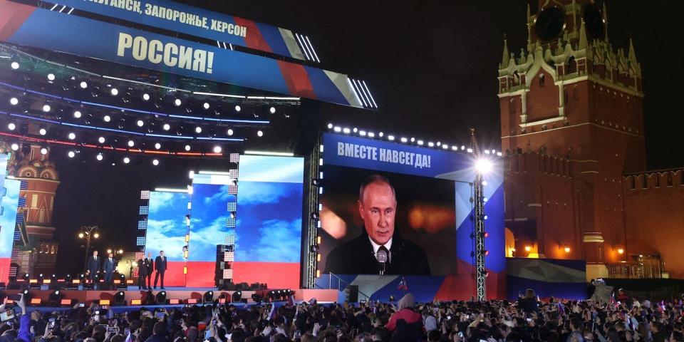 Russian President Vladimir Putin on a massive screen in Red Square, in front of crowds at a concert marking Russia's claimed annexation of four regions of Ukraine, September 30 2022