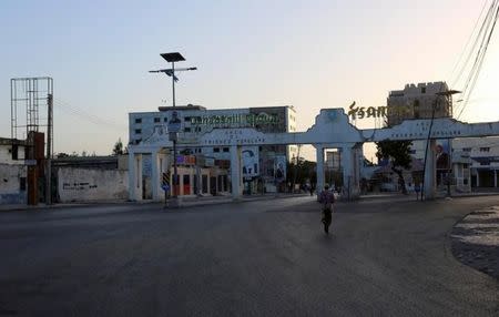 A man walks along a deserted street during the presidential vote at the airport in Somalia's capital Mogadishu February 8, 2017. REUTERS/Feisal Omar