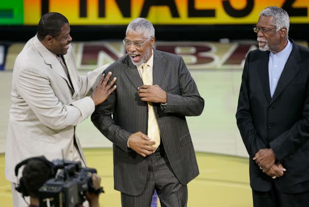 PHOTO: NBA great Patrick Ewing with NBA Hall of Famers Julius Irving and Bill Russell in Game 3 of the NBA Finals in Clevaland, June 12, 2007.  (Amy Sancetta/AP, FILE)