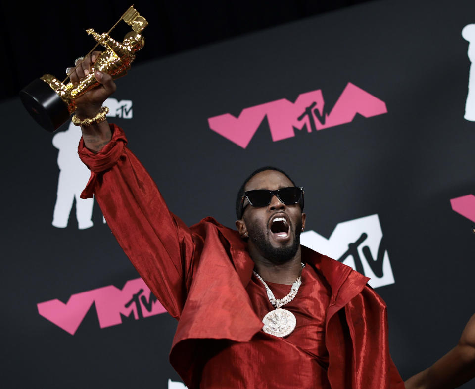 Diddy holds up his Global Icon Award at the 2023 MTV Video Music Awards.