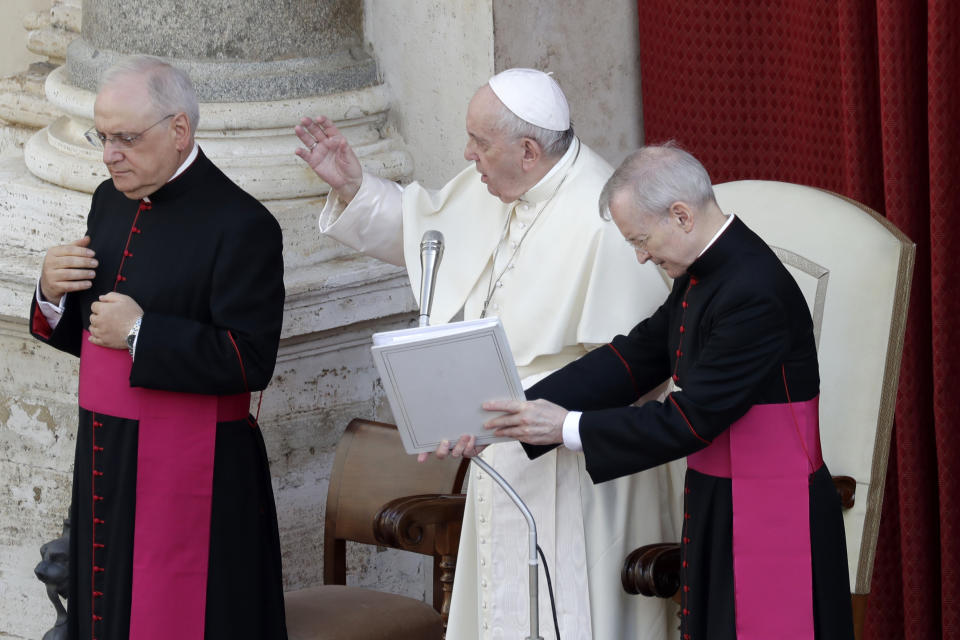 Pope Francis, center, delivers his blessing during his general audience, the first with faithful since February when the coronavirus outbreak broke out, at the San Damaso courtyard forat the Vatican, Wednesday, Sept. 2, 2020. (AP Photo/Andrew Medichini)