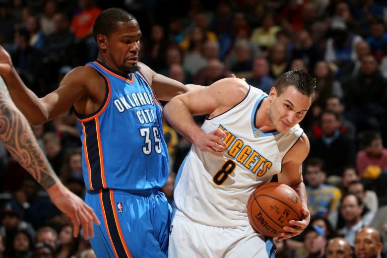 Denver Nuggets' Danilo Gallinari (R) and Oklahoma City Thunder's Kevin Durant during their game at Pepsi Center on January 19, 2016