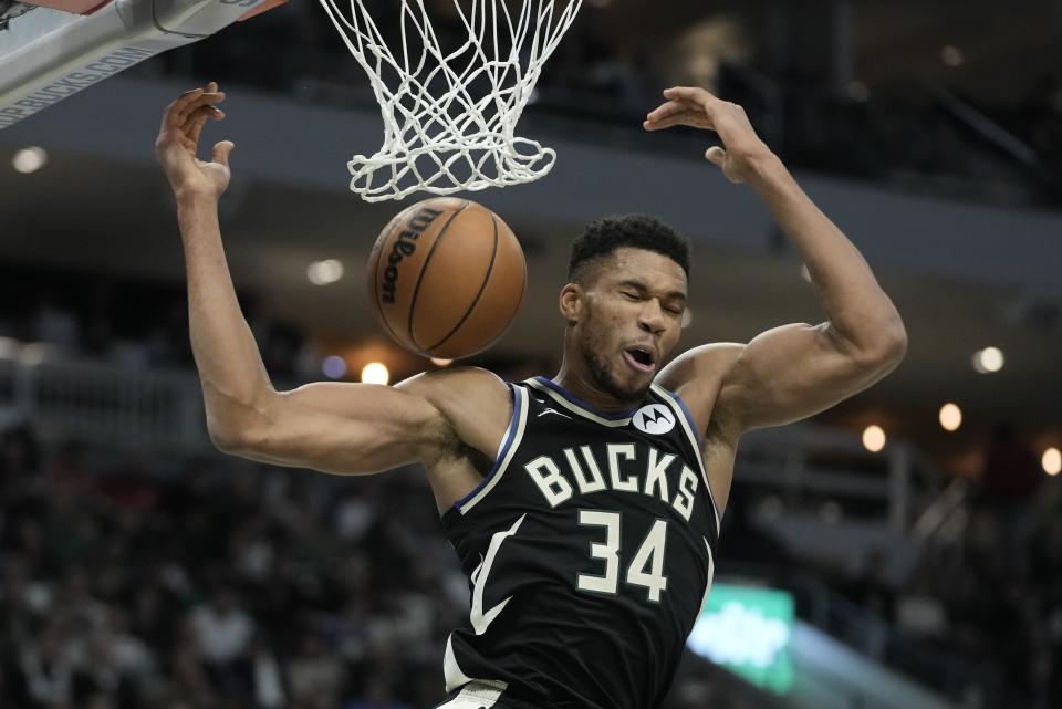 Milwaukee Bucks' Giannis Antetokounmpo dunks during the second half of an NBA basketball game against the Detroit Pistons Monday, Oct. 31, 2022, in Milwaukee. The Bucks won 110-108. (AP Photo/Morry Gash)