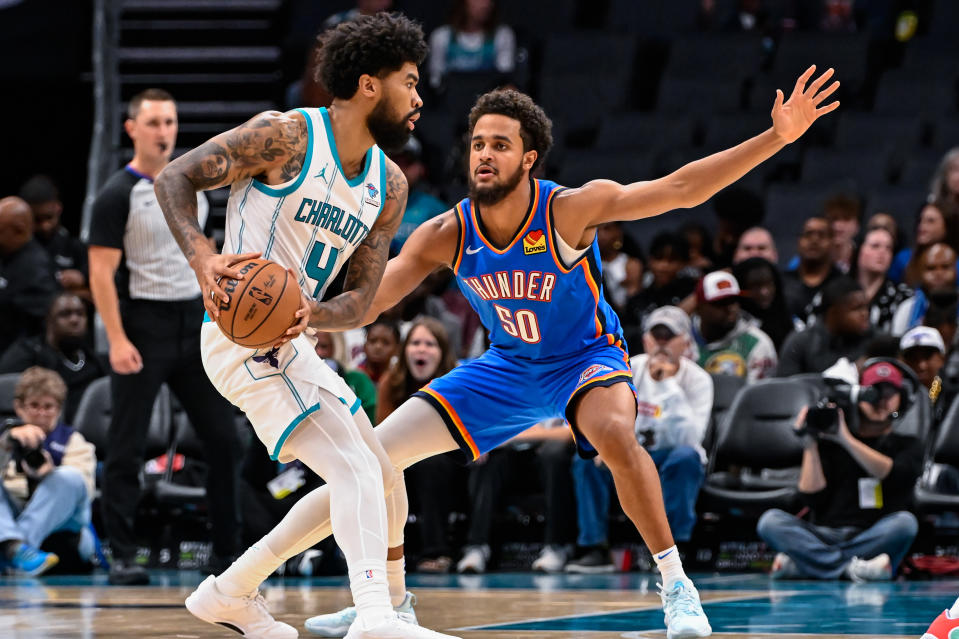 CHARLOTTE, NORTH CAROLINA – OCTOBER 15: Jeremiah Robinson-Earl #50 of the Oklahoma City Thunder defends Nick Richards #4 of the Charlotte Hornets during the second half of their game at Spectrum Center on October 15, 2023 in Charlotte, North Carolina. (Photo by Matt Kelley/Getty Images)