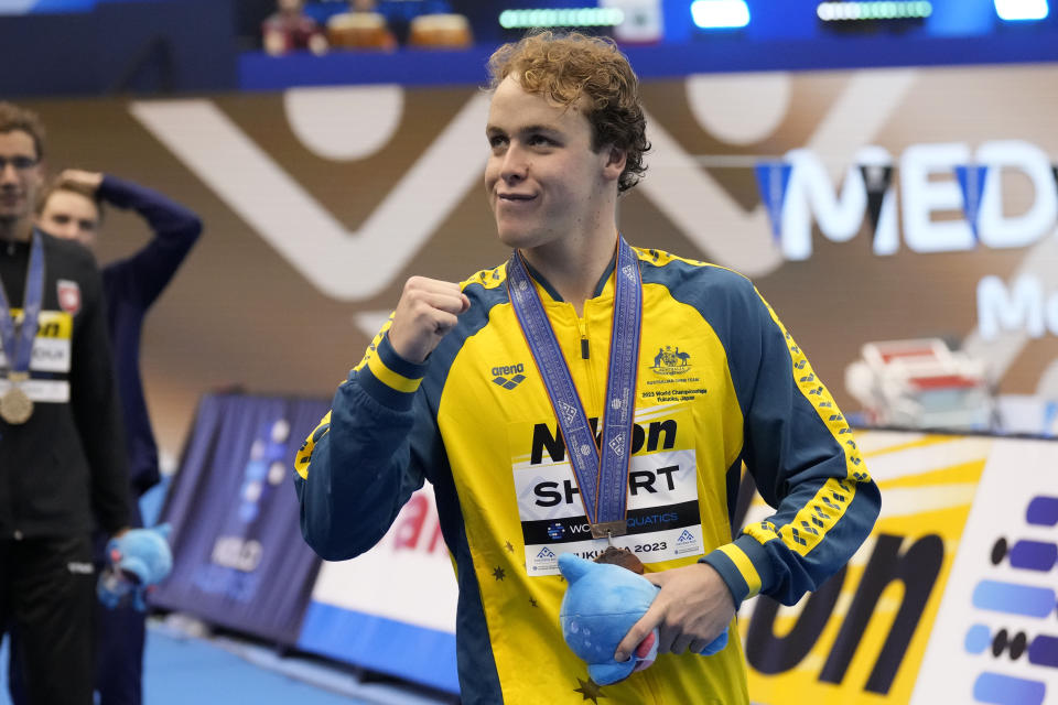 Bronze medalist Samuel Short of Australia celebrates during the medal ceremony for men's 1500 freestyle at the World Swimming Championships in Fukuoka, Japan, Sunday, July 30, 2023. (AP Photo/Lee Jin-man)