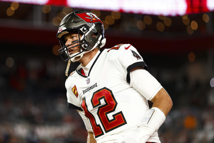 TAMPA, FL - JANUARY 16: Tom Brady #12 of the Tampa Bay Buccaneers runs onto the field prior to an NFL wild card playoff football game against the Dallas Cowboys at Raymond James Stadium on January 16, 2023 in Tampa, Florida. (Photo by Kevin Sabitus/Getty Images)