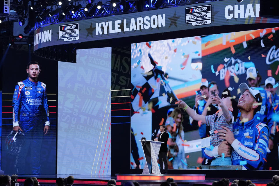 NASCAR Cup Series champion Kyle Larson speaks during the NASCAR Awards, Thursday, Dec. 2, 2021, in Nashville, Tenn. (AP Photo/Mark Humphrey)