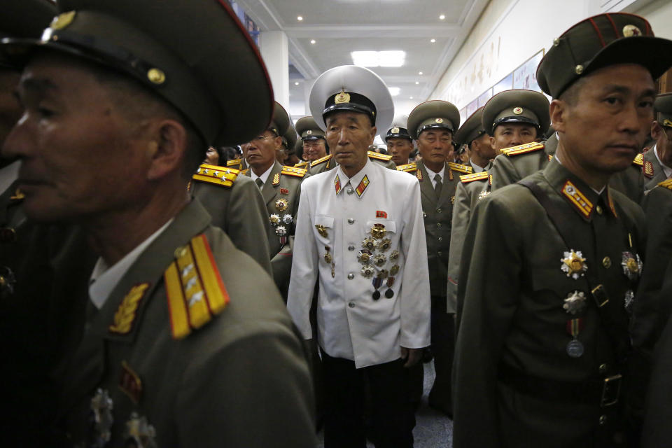 North Koreans military officers leave after attending an evening gala held on the eve of the 70th anniversary of North Korea's founding day in Pyongyang, North Korea, Saturday, Sept. 8, 2018. North Korea will be staging a major military parade, huge rallies and reviving its iconic mass games on Sunday to mark its 70th anniversary as a nation. (AP Photo/Kin Cheung)