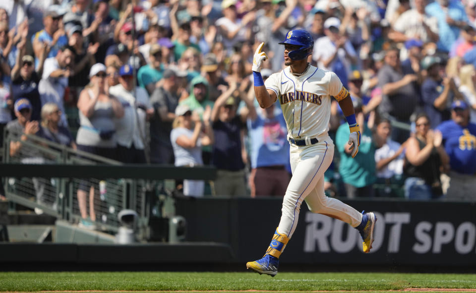 Seattle Mariners' Julio Rodriguez jogs the bases after hitting a two-run home run to score Josh Rojas against the Kansas City Royals during the fifth inning of a baseball game, Sunday, Aug. 27, 2023, in Seattle. (AP Photo/Lindsey Wasson)