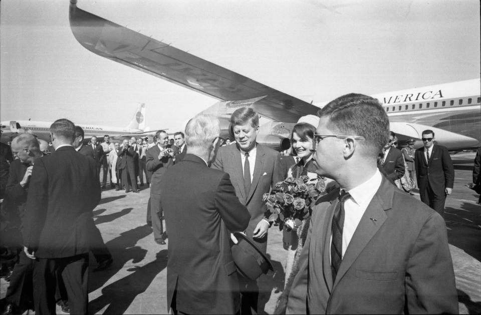 Paul Landis, right, is seen standing near President John F. Kennedy as he arrives at Love Field in Dallas, Nov. 22, 1963. Landis was interviewed for "JFK: One Day in America," a National Geographic three-part limited docuseries.