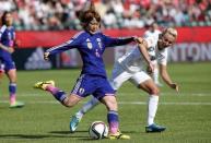 Jul 1, 2015; Edmonton, Alberta, CAN; Japan midfielder Mizuho Sakaguchi (6) and England forward Toni Duggan (18) fight for the ball during the first half in the semifinals of the FIFA 2015 Women's World Cup at Commonwealth Stadium. Mandatory Credit: Erich Schlegel-USA TODAY Sports