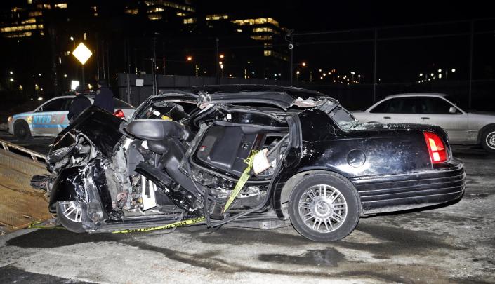 A car remains on the scene of an accident in New York, Wednesday, Feb. 11, 2015, that killed longtime &quot;60 Minutes&quot; correspondent Bob Simon. Simon covered riots, Academy Award-nominated movies and wars and was held captive for more than a month in Iraq two decades ago. He was 73. (AP Photo/Kathy Willens)