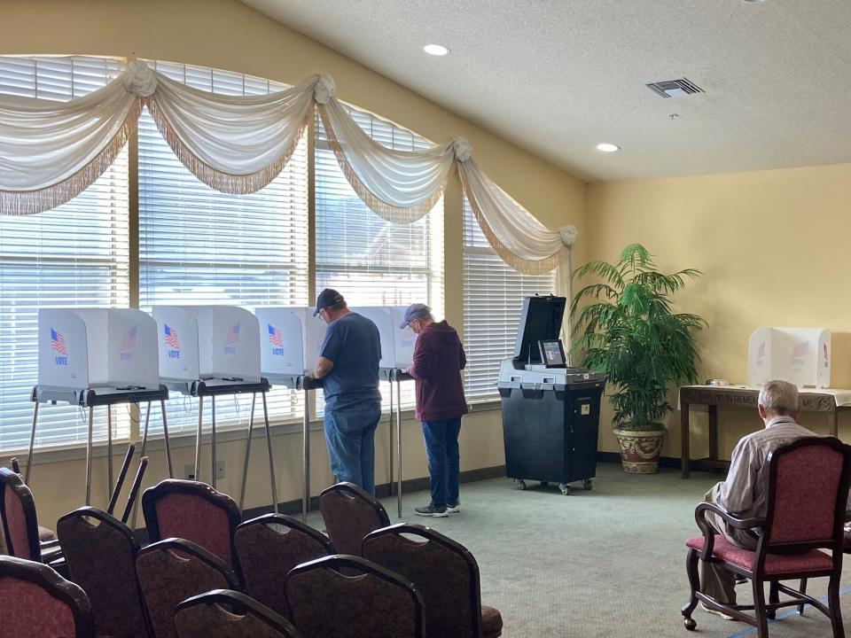 Two people cast their ballots at Sunnybrook Estates in Madison Tuesday morning.