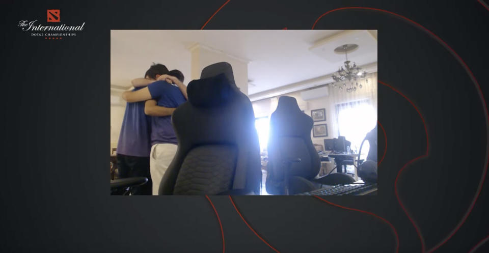 Nigma Galaxy members hugging in a room