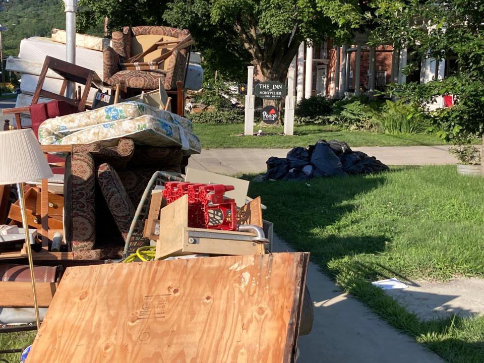 Rubble remains piled near The Inn at Montpelier and Penzo Pizza Co. on July 20, 2023, more than a week after floods devastated much of downtown Montpelier.