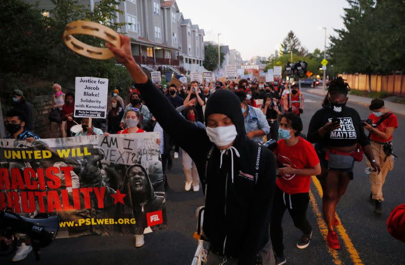 FILE PHOTO: Demonstrators take part in a rally against racial inequality and justice for Jacob Blake, in Boston