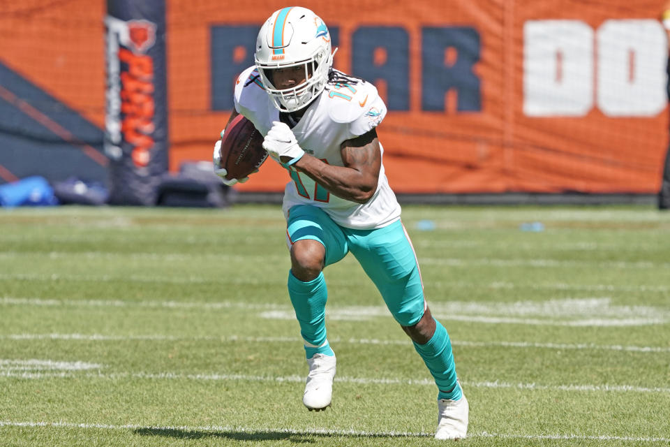 FILE - Miami Dolphins wide receiver Jaylen Waddle (17) warms up before an NFL preseason football game in Chicago, in this Saturday, Aug. 14, 2021, file photo. Dolphins quarterback Tua Tagovailoa will work with an upgraded cast of targets this season, including former Alabama teammate Jaylen Waddle, Miami's first draft pick.(AP Photo/David Banks)