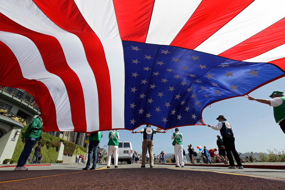 <p>Members of the Native Sons of the Golden West carry a large American flag during the annual Fourth of July Parade Wednesday, July 4, 2012 in Sausalito, Calif. The group was founded in 1875 and has preserved many of the landmarks of California’s pioneer days, purchasing and rehabilitating them and then donating them to the State or local governments. (Photo: Eric Risberg/AP) </p>