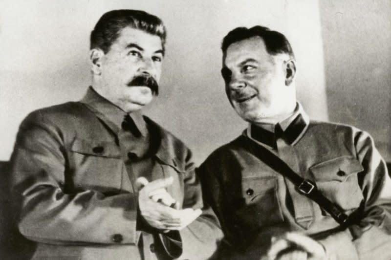 Josef Stalin, dictator of Russian (L) is pictured with Minister of War Kliment Voroshilov on the presidium of the conference of men and women Stakhanovite workers in the Grand Hall of the Kremlin Palace in Moscow in December 1935. On March 3, 1938, the last of three of Stalin's public show trials began, with the defendants being charged in a plot to murder Stalin. UPI File Photo