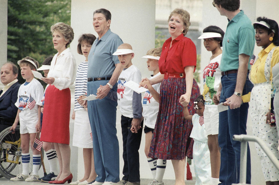 President Ronald Reagan and first lady Nancy Reagan participating in the 1986 charity event Hands Across America. (Photo: ASSOCIATED PRESS)