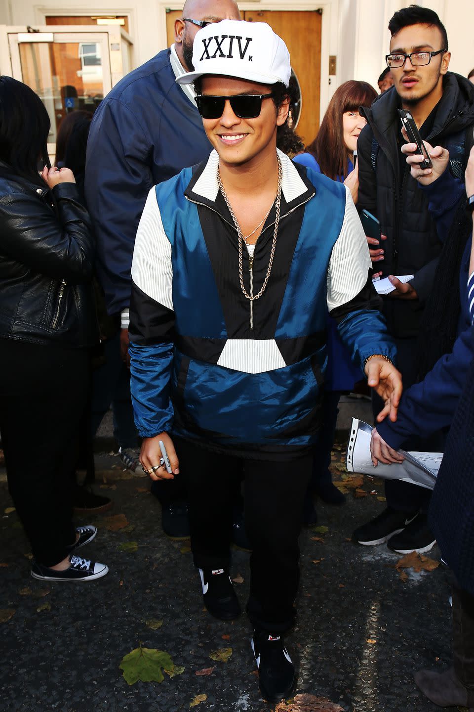 <p>As you'll soon come to know, Bruno Mars likes silky track jackets, bold chains, and sunglasses - regardless of weather, location, or time of day. </p>