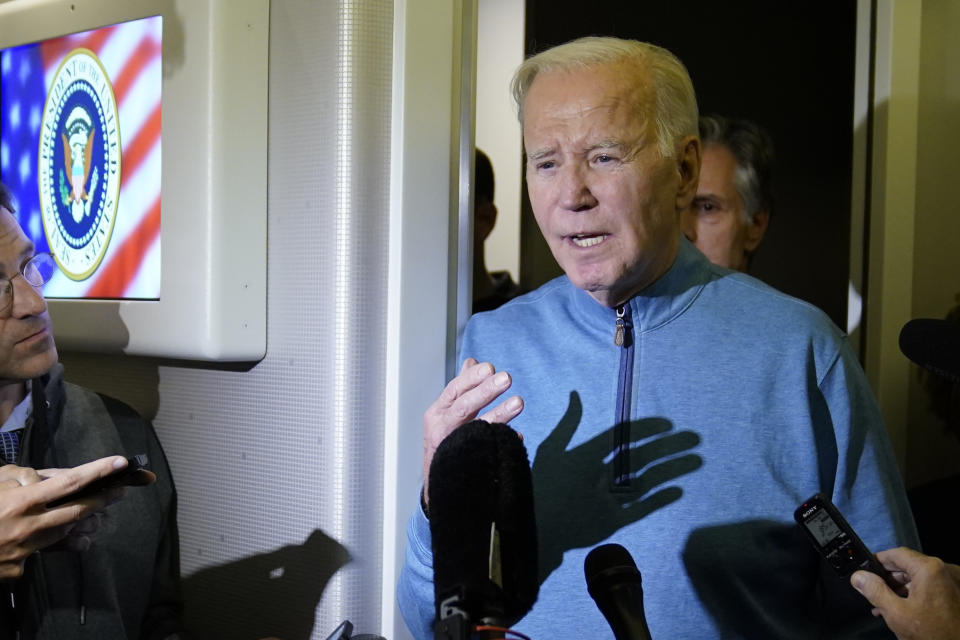 FILE - President Joe Biden talks to reporters aboard Air Force One during a refueling stop in at Ramstein Air Base in Germany, Oct. 18, 2023, as he travels back from Israel to Washington. Nearly half of Democrats disapprove of how Biden is handling the Israel-Hamas conflict, according to a new Associated Press-NORC Center for Public Affairs Research poll. The war could complicate Biden's reelection effort as he tries to balance factions of his party with very different views on the conflict. (AP Photo/Evan Vucci)