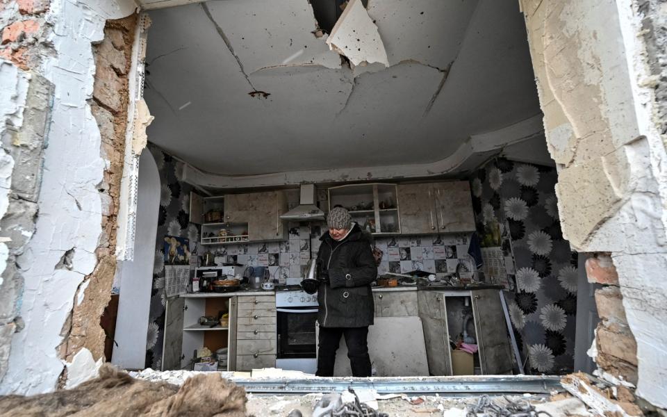 A local resident, Liubov Onyschenko, is seen in her house heavily damaged by a Russian missile strike in the village of Kupriianivka, Zaporizhzhia - REUTERS