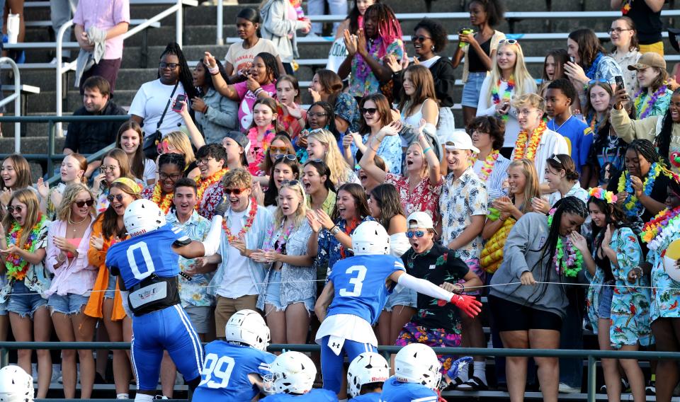 The South Bend Adams players greet the students in the grandstands during the Adams vs. Culver Academy football game Friday, Aug. 18, 2023, at School Field in South Bend.