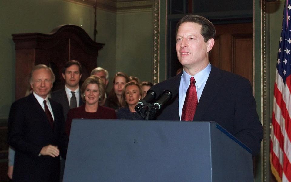 Vice president Al Gore stands at the podium, after conceding the presidential election, Wednesday, December 13, 2000.