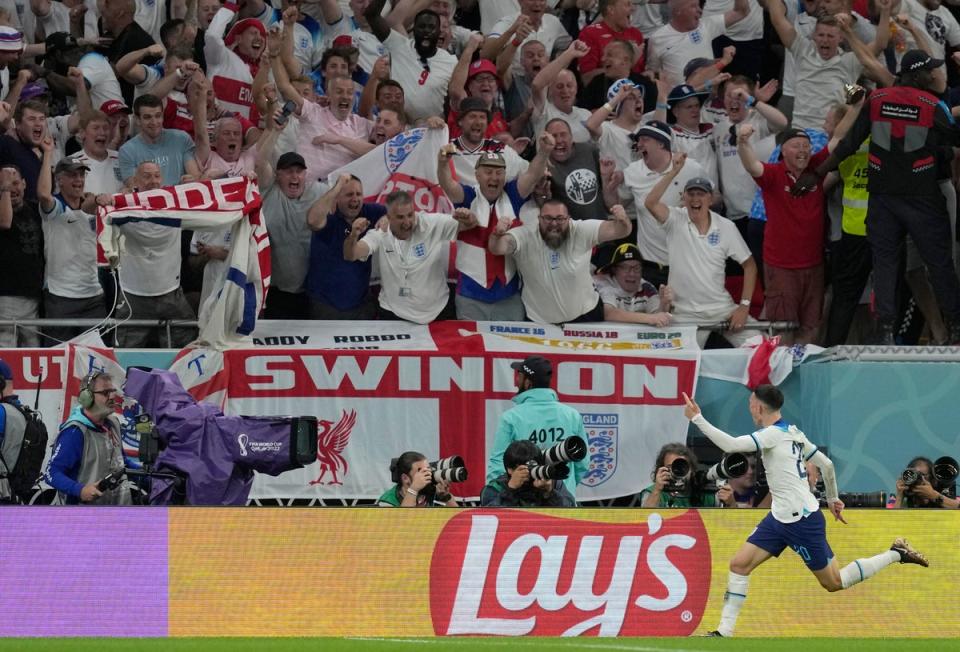 29 November 2022: Phil Foden celebrates after scoring England’s second goal against Wales during the World Cup group match at the Ahmad Bin Ali Stadium in Qatar (AP)