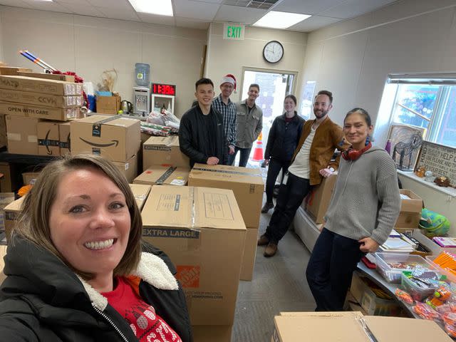 <p>Lucid Software</p> Lucid employees deliver boxes to a local elementary school as part of their Adopt a Family efforts.