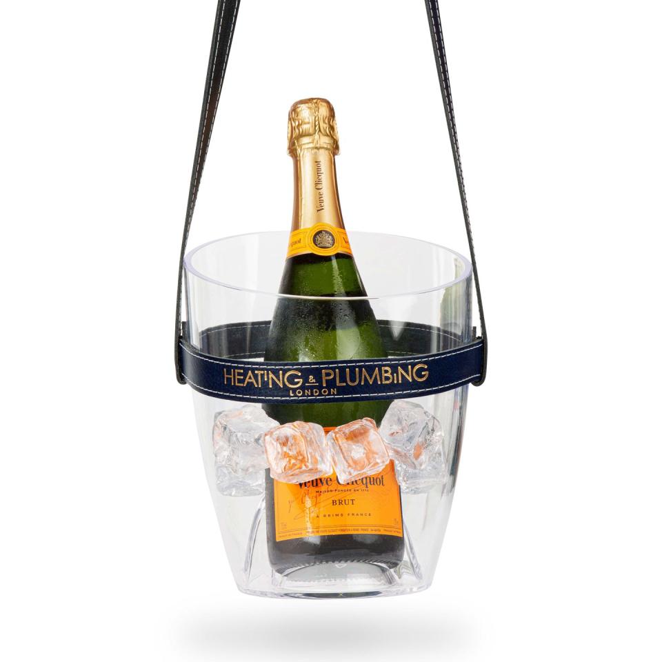 <p>Nothing signals your picnic as a cut above the rest quite like arriving with a perfectly chilled bottle of bubbles swung over your shoulder. This handy Champagne bucket comes with an extra-long strap and is brought to you by Heating and Plumbing, a brand which also produces blankets and wicker hampers. £85, <a href="https://go.redirectingat.com?id=127X1599956&url=https%3A%2F%2Fwww.wolfandbadger.com%2Fuk%2Fkeep-your-cool-champagne-bucket-purple-leather-strap%2F%3Fresult_index%3D45%26query_id%3D561a42dac6c8cb1958b04e900e52f657&sref=https%3A%2F%2Felledecoration.co.uk%2Fdesign%2Fg36766200%2Fbest-picnic-sets%2F" rel="nofollow noopener" target="_blank" data-ylk="slk:wolfandbadger.com;elm:context_link;itc:0;sec:content-canvas" class="link ">wolfandbadger.com</a></p>