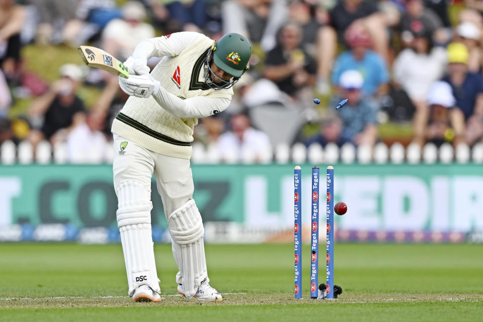 Australia's Usman Khawaja is bowled by New Zealand's Matt Henry on the first day of their cricket test match in Wellington, New Zealand, Thursday, Feb. 29, 2024. (Kerry Marshall/Photosport via AP)