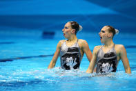 LONDON, ENGLAND - AUGUST 05: Natalia Ischenko and Svetlana Romashina of Russia compete in the Women's Duets Synchronised Swimming Technical Routine on Day 9 of the London 2012 Olympic Games at the Aquatics Centre on August 5, 2012 in London, England. (Photo by Al Bello/Getty Images)