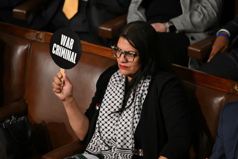 In the cartoon, a woman identified as Rep. Tlaib is seen sitting at a desk next to an exploding electronic device (SAUL LOEB)