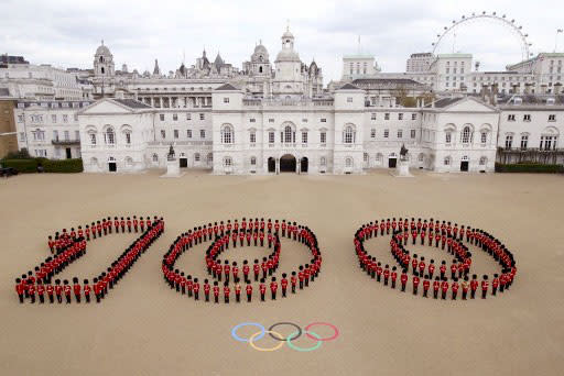 260 Guardsmen from the Grenadier, Coldstream, Scots and Welsh Guards forming a giant "100" at Horse Guards Parade in London to mark 100 days to go until the 2012 London Olympic Games. London marked on April 18, 100 days to go until Queen Elizabeth II declares the 2012 London Olympics open, making the British capital the first city in the modern era to host the Games three times.  AFP PHOTO / LONDON 2012