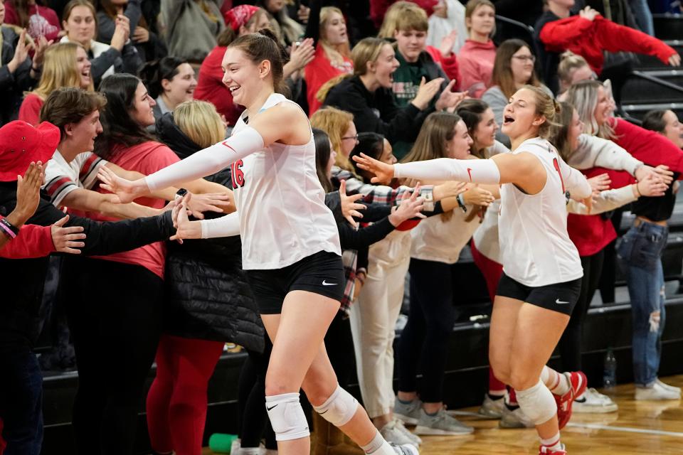 Dec 2, 2022; Columbus, Ohio, USA;  Ohio State Buckeyes Adria Powell (16) and Sydney Taylor (11) celebrate their three set win over the Tennessee State Tigers with fans in the student section following the NCAA women's volleyball tournament first round match at the Covelli Center. Mandatory Credit: Adam Cairns-The Columbus Dispatch