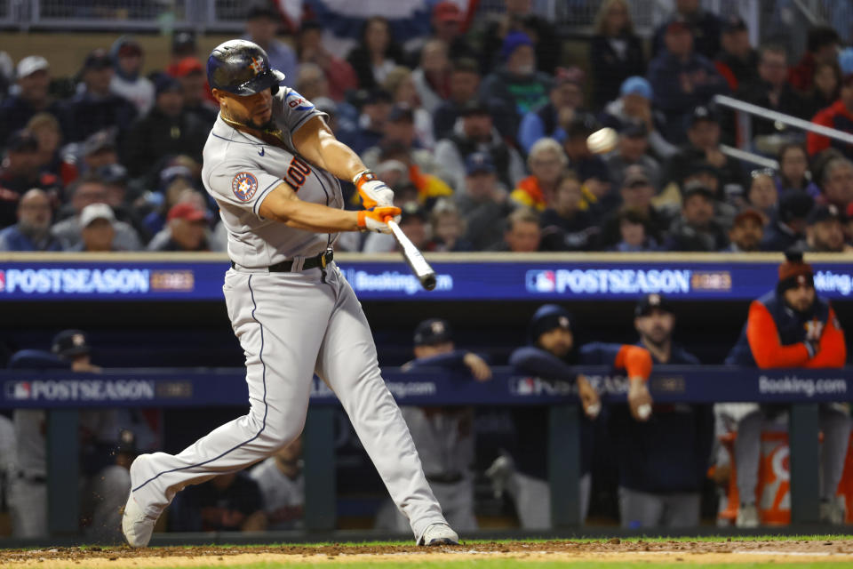 Houston Astros' Jose Abreu connects for a two-run home run during the fourth inning of Game 4 of a baseball AL Division Series against the Minnesota Twins, Wednesday, Oct. 11, 2023, in Minneapolis. (AP Photo/Bruce Kluckhohn)