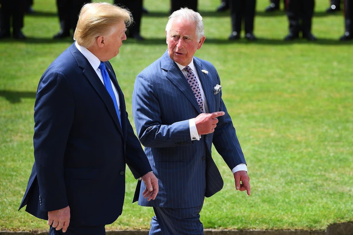 Donald Trump pictured walking alongside King Charles at Buckingham Palace during a 2019  state visit to the UK   (AFP/Getty)