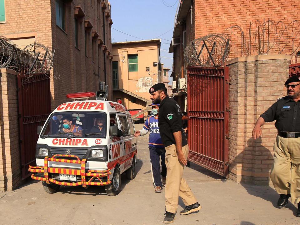 An ambulance car transports the body of Tahir Naseem, who was shot dead in a court room: EPA/BILAWAL ARBAB