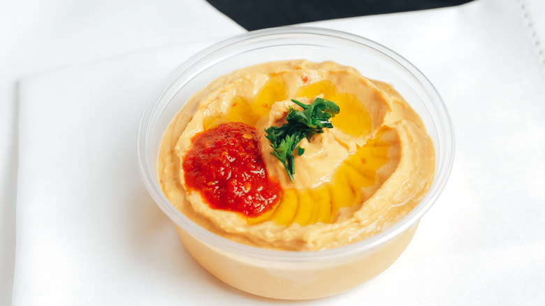 packed hummus with spicy sauce